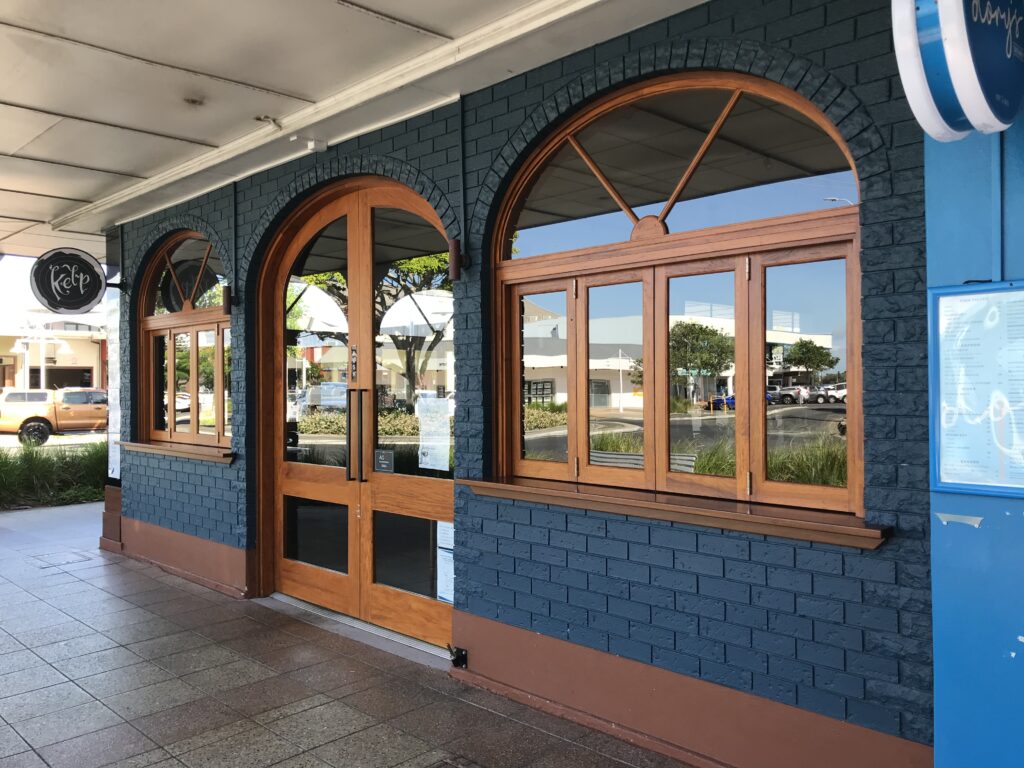 Window cleaner removing dirt and salt residue from glass